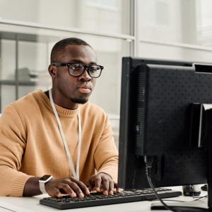 African America man working on his computer in Cybersecurity